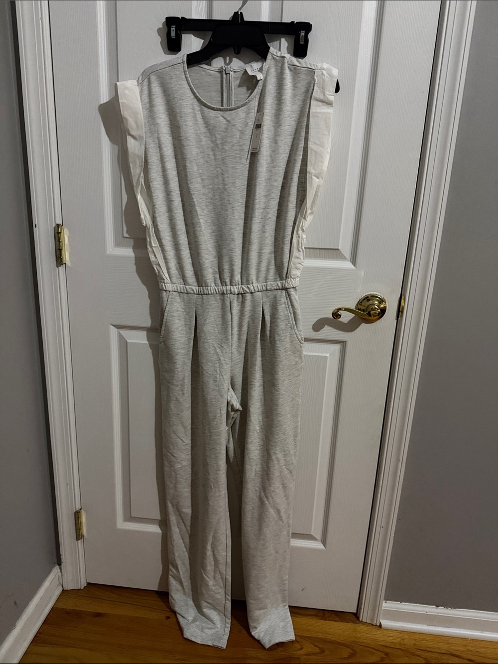 Sleeveless Light Gray Jumpsuit with White Ruffle Shoulders